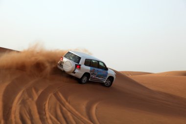 Dune bashing in Duba clipart