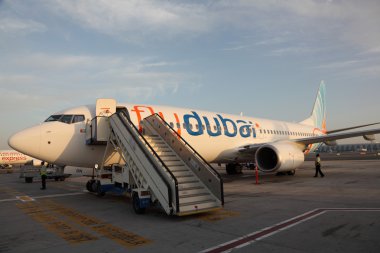 Flydubai airplane at the Dubai International Airport clipart