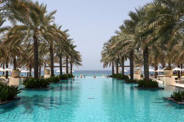Swimming pool of the Al Bustan hotel in Muscat, Oman clipart