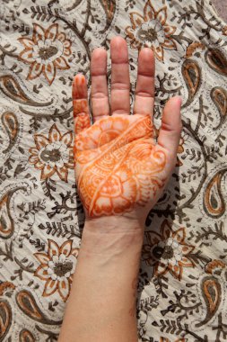 Hand decorated with traditional Indian henna tatoo clipart