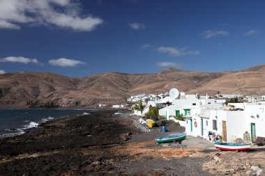 Fishing village Playa Quemada on Canary Island Lanzarote, Spain clipart