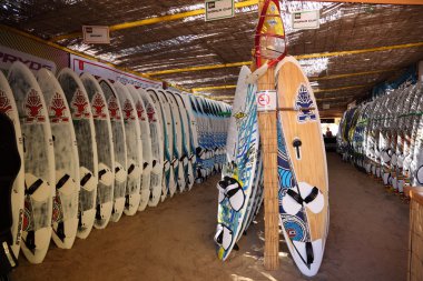 Surfboards lined up on the racks at famous Sotavento Beach in Canary Island clipart