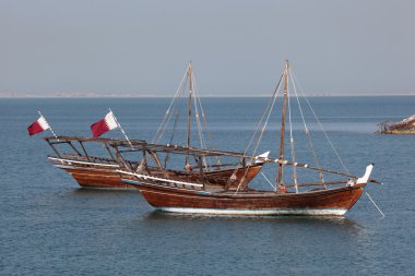 Traditional arabic dhows in Doha, Qatar clipart