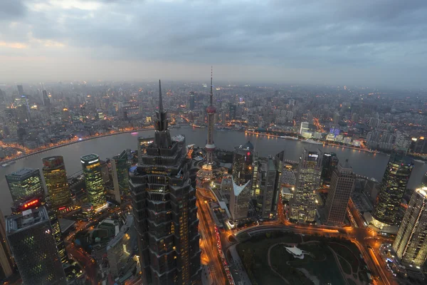 Aerial view over the city of Shanghai at night — Stock Photo, Image