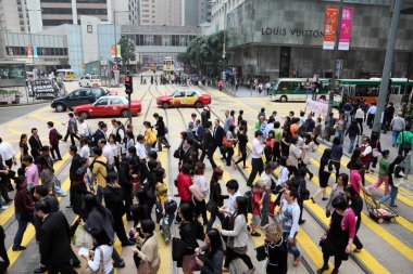 Crowded cross-walk in the city of Hong Kong clipart