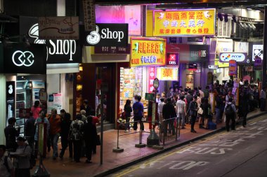 Street in Wan Chai, Hong Kong at night clipart