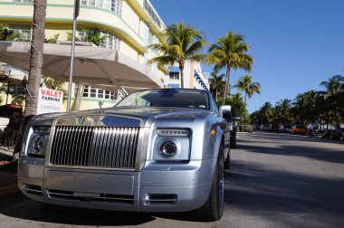 Rolls Royce parked at Ocean Drive in Miami Beach clipart