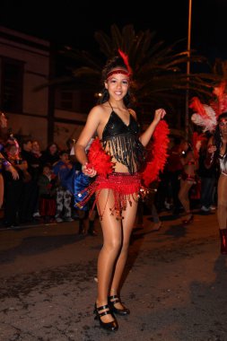 Cruz de Tenerife Carnival 2011: Young woman dancing on the street clipart