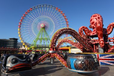 Ferris wheel and carousel in Santa Cruz de Tenerife clipart