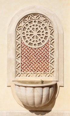 Water tap at the Qatar State Grand Mosque in Doha clipart