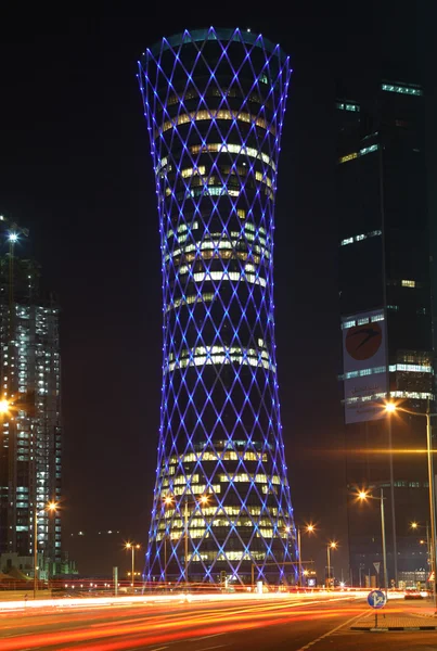 Blue illuminated QIPCO Tower in Doha, Qatar — Stock Photo, Image