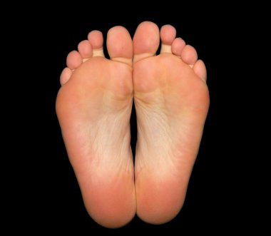 Feet isolated on black background clipart