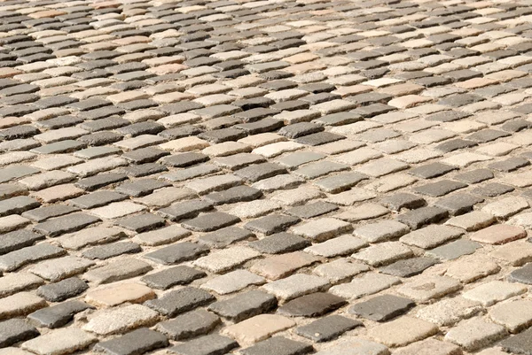 バルセロナ、スペインで古代の玉石の舗装道路 — ストック写真