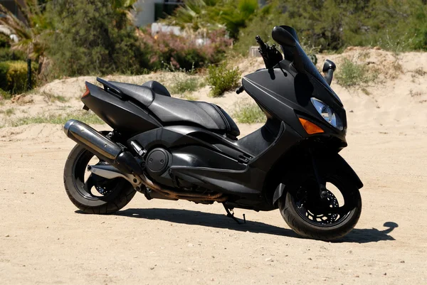 Big black scooter parked outdoors — Stock Photo, Image