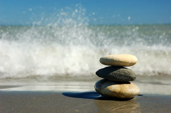 stock image Three balanced stones on the beach