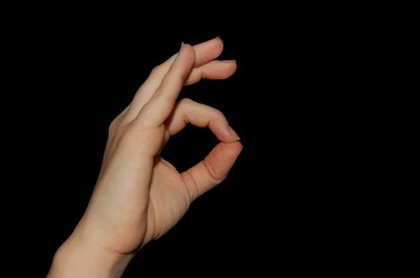 Signo de mano para OK, aislado en negro — Foto de Stock