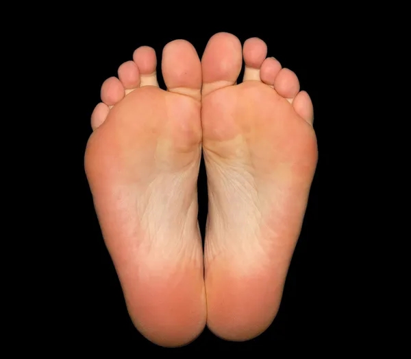 stock image Feet isolated on black background