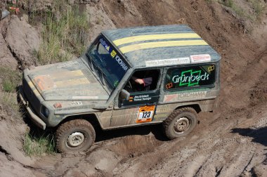 Mercedes Benz G Model at offroad rally competition clipart