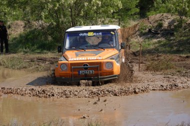 Mercedes Benz G Model at offroad rally competition clipart