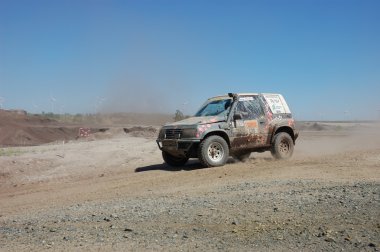 Suzuki Vitara at offroad rally competition clipart