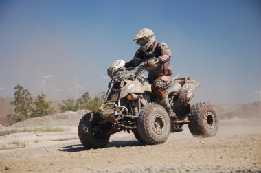 An all-terrain vehicle (ATV) at offroad rally competition clipart
