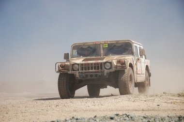 Hummer H1 at offroad rally competition clipart