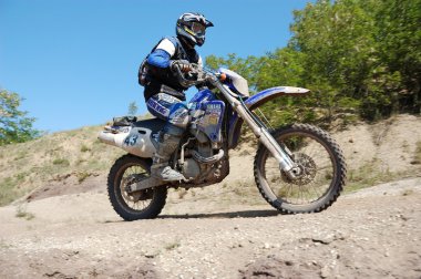 Enduro rider at motocross competition clipart