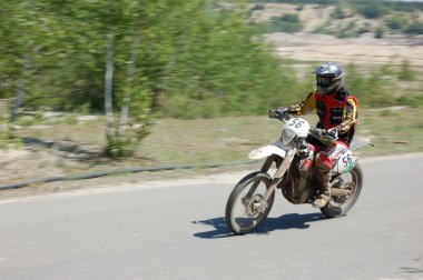 Enduro rider at motocross competition clipart