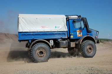 Mercedes Benz Unimog rally truck at offroad competition clipart