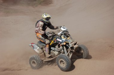 An all-terrain vehicle (ATV) at offroad rally competition clipart