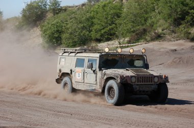 Hummer H1 at offroad rally competition clipart