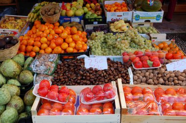 Fresh vegetables, beans, honey and fruits at a farmer's market clipart