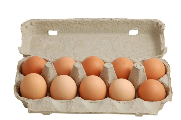 Яйця в коробці ізольовані відсічним контуром — стокове фото
