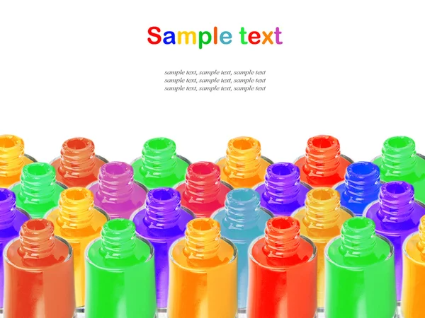 Bottiglie con smalto versato su sfondo bianco — Foto Stock