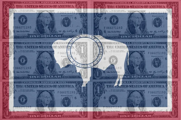 Oss delstaten Wyoming, USA flagga med transparent dollar sedlar i ba — Stockfoto