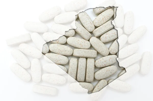 Карта Алжира с таблетками на заднем плане для здоровья — стоковое фото