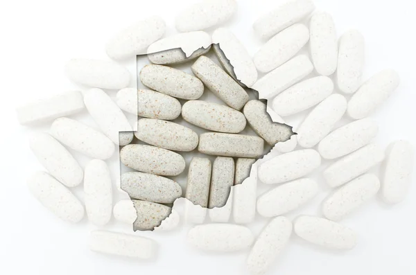 Umrisskarte von Botswana mit Pillen im Hintergrund für die Gesundheit — Stockfoto