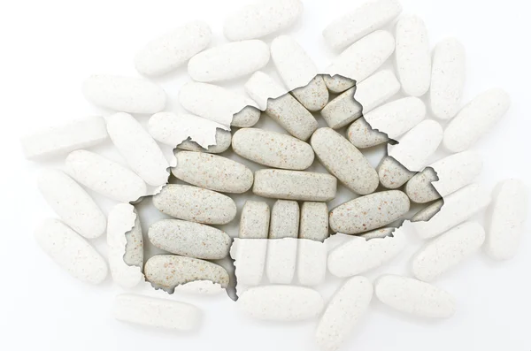 Outline map of burkina faso with pills in the background for hea — Stock Photo, Image