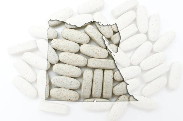 Konturkarta över Egypten med piller i bakgrunden för hälsa och — Stockfoto