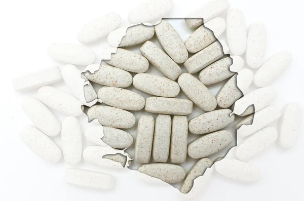 Outline map of sierra leone with pills in the background for hea — Stock Photo, Image