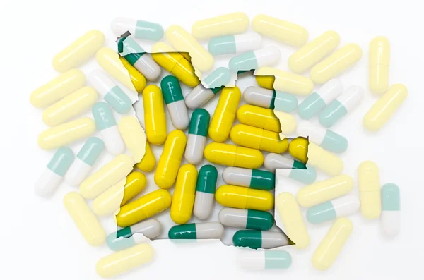 Konturkarta över angola med piller i bakgrunden för hälsa en — Stockfoto