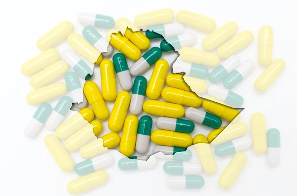 Konturkarta över Etiopien med piller i bakgrunden för hälsa — Stockfoto
