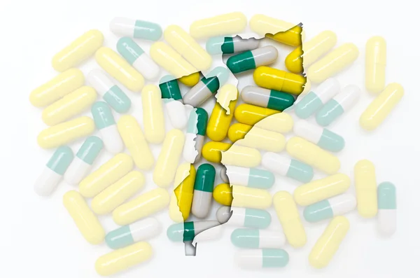 Umrisskarte von Mosambik mit Pillen im Hintergrund zur Heilung — Stockfoto