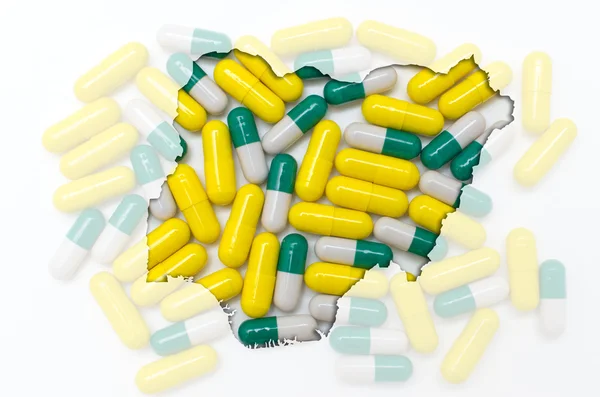 Konturkarta över nigeria med piller i bakgrunden för hälsa en — Stockfoto