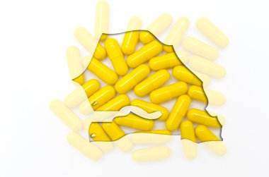 Outline map of senegal with pills in the background for health a clipart