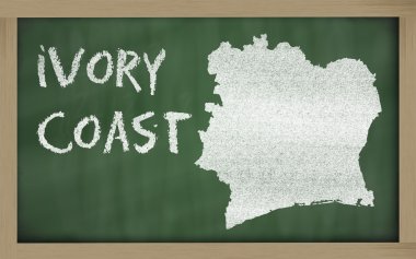 Outline map of ivory coast on blackboard clipart