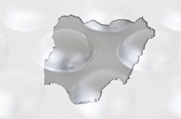 Mappa schematica della Nigeria con pillole sullo sfondo per la salute a — Foto Stock