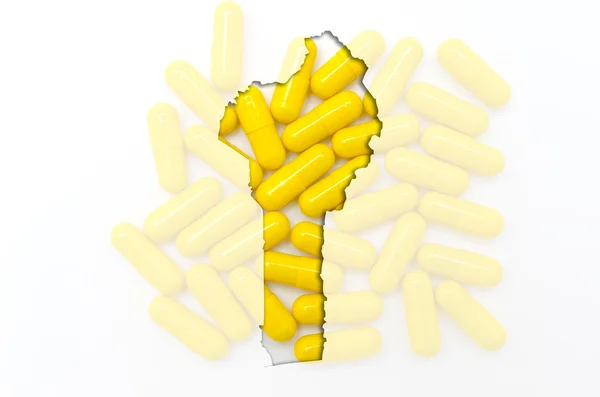 Outline map of benin with pills in the background for health and — Stock Photo, Image