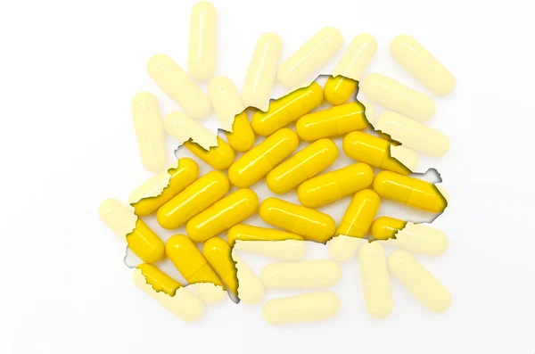A tabletták, a háttérben a hea szerkezeti burkina faso Térkép — Stock Fotó