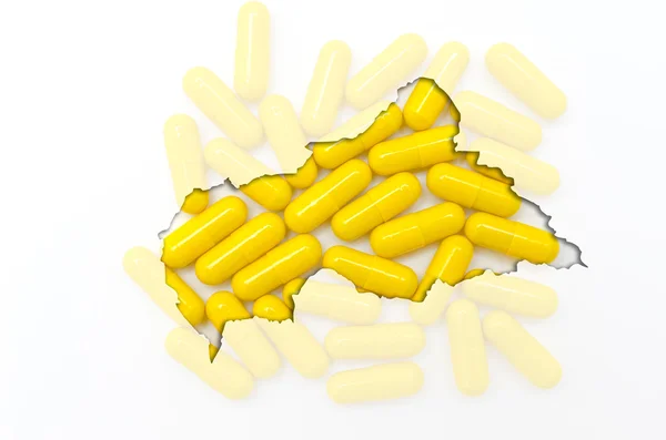 A tabletták, a háttérben a körvonala a Közép-afrikai Köztársaság — Stock Fotó